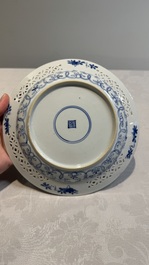 Two Chinese blue and white 'reticulated border' plates, Kangxi