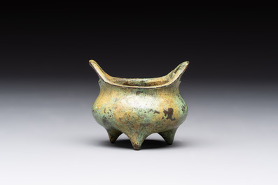 A Chinese bronze tripod censer with cover and stand, a small tripod censer and a silver-inlaid iron brush pot, 19/20th C.