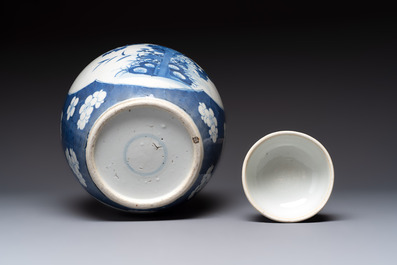 A pair of Chinese blue and white bronze-mounted vases and a covered jar, 19th C.