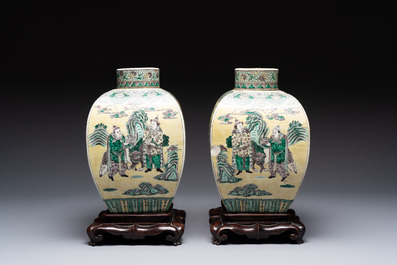 A pair of Chinese verte biscuit covered square jars on wooden stand, 19th C.