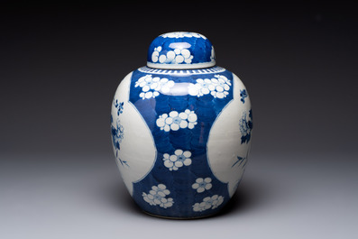 A pair of Chinese blue and white bronze-mounted vases and a covered jar, 19th C.