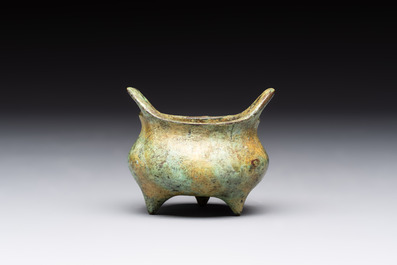 A Chinese bronze tripod censer with cover and stand, a small tripod censer and a silver-inlaid iron brush pot, 19/20th C.