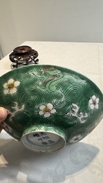A Chinese verte biscuit 'animals among waves' bowl and a wooden stand, Jiajing mark, Kangxi