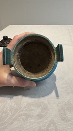 A Chinese turquoise-glazed tripod censer with wooden cover, Ming