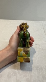 A pair of Chinese sancai-glazed Buddhist lions and an inkwell, 19th C.