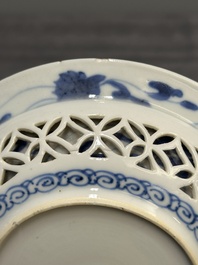 A Chinese blue and white reticulated double-walled cup and saucer, fu mark, Kangxi