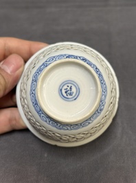 A Chinese blue and white reticulated double-walled cup and saucer, fu mark, Kangxi