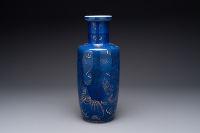 A Chinese gilt-decorated powder-blue 'dragon and phoenix' rouleau vase, 19th C.