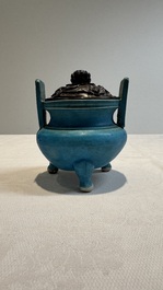 A Chinese turquoise-glazed tripod censer with wooden cover, Ming