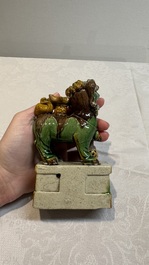 A pair of Chinese sancai-glazed Buddhist lions and an inkwell, 19th C.