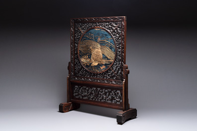 A Chinese wooden table screen with an embroidered silk with turtle design, 19th C.