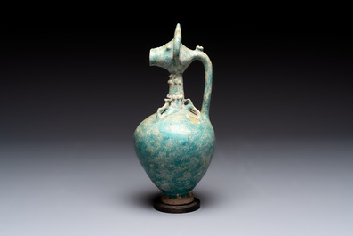 A green-glazed and a turquoise-glazed Kashan jug, Persia, 12/13th C.