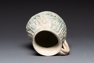 A green-glazed and a turquoise-glazed Kashan jug, Persia, 12/13th C.