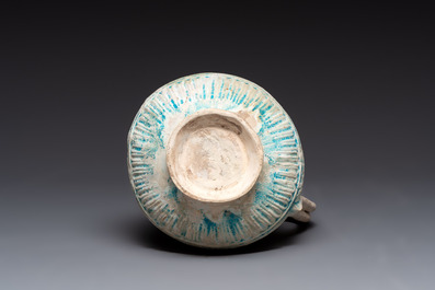 A green-glazed and a turquoise-glazed Kashan jug, Persia, 12/13th C.