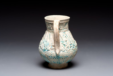 A green-glazed and a turquoise-glazed Kashan jug, Persia, 12/13th C.