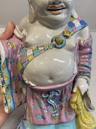 A Chinese famille rose Milefo Buddha on wooden stand, 19th C.