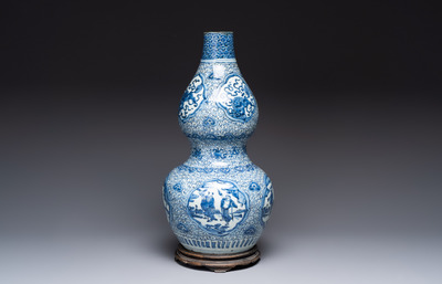 An impressive Chinese blue and white 'Eight Immortals' double gourd vase, Jiajing/Wanli