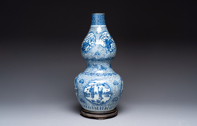 An impressive Chinese blue and white 'Eight Immortals' double gourd vase, Jiajing/Wanli