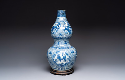 An impressive Chinese blue and white 'Eight Immortals' double gourd vase, Jiajing/Wanli