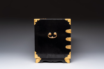A rare Japanese black-lacquered cabinet with finely engraved gilt mounts, Edo, late 17th C.