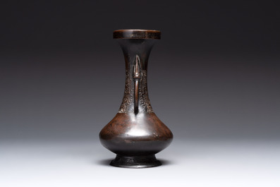 A Chinese archaistic bronze vase and three Japanese bronze vases, 14/18th C.