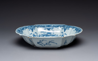 A blue and white Dutch Delft basin with putti near a fountain, 18th C.