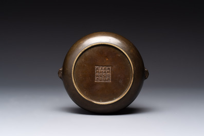 A Chinese bronze censer with lion-form handles, 大明宣德五年監造工部官監吳邦佐造 mark, 18th C.