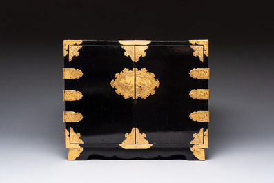 A rare Japanese black-lacquered cabinet with finely engraved gilt mounts, Edo, late 17th C.