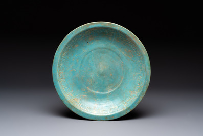 A turquoise-glazed calligraphic dish and a bowl, Kashan, 13/14th C.