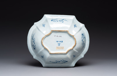A blue and white Dutch Delft basin with putti near a fountain, 18th C.