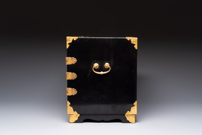 A rare Japanese black-lacquered cabinet with finely engraved gilt mounts, Edo, late 17th C.