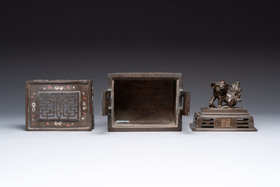 A large Vietnamese copper- and silver-inlaid rectangular 'Buddhist lion' censer and cover on stand, 19th C.