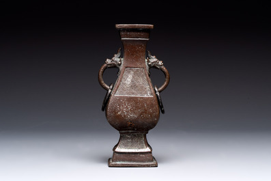 A Chinese archaistic bronze vase and three Japanese bronze vases, 14/18th C.