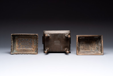 A large Vietnamese copper- and silver-inlaid rectangular 'Buddhist lion' censer and cover on stand, 19th C.