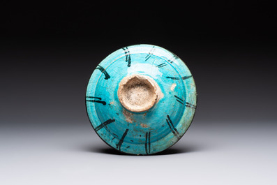 Two turquoise-and-black-glazed bowls, Kashan, 13/14th C.
