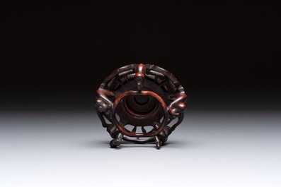 A Chinese verte biscuit 'animals among waves' bowl and a wooden stand, Jiajing mark, Kangxi