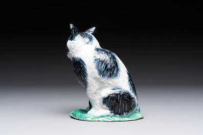A fine polychrome Brussels faience model of a cat, 18th C.