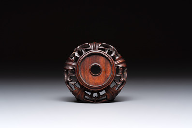 A Chinese verte biscuit 'animals among waves' bowl and a wooden stand, Jiajing mark, Kangxi