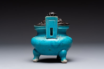 A Chinese turquoise-glazed tripod censer with wooden cover, Ming