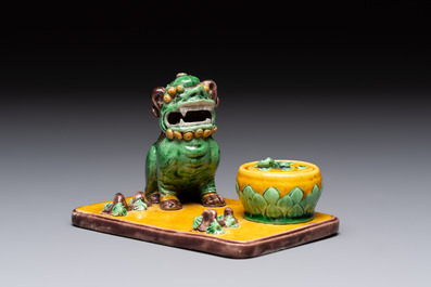 A pair of Chinese sancai-glazed Buddhist lions and an inkwell, 19th C.