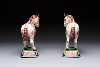 A pair of polychrome and gilt-decorated Dutch Delft petit feu horses, 18th C.