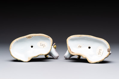A pair of polychrome Dutch Delft reclining cows, 18th C.