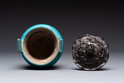 A Chinese turquoise-glazed tripod censer with wooden cover, Ming