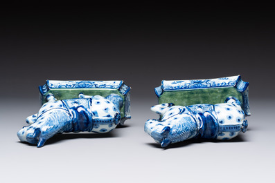 A pair of blue and white Dutch Delft prancing horses on a green-glazed base, 18th C.