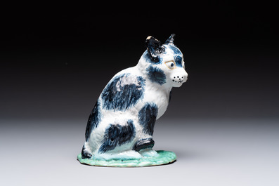 A fine polychrome Brussels faience model of a cat, 18th C.