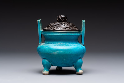 A Chinese turquoise-glazed tripod censer with wooden cover, Ming