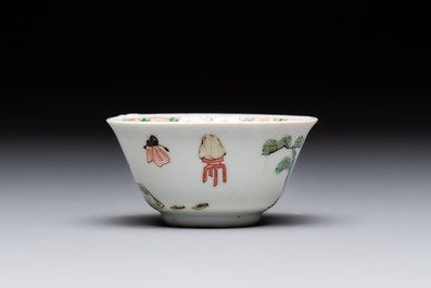 A Chinese famille verte 'erotic' cup and saucer, lingzhi mark, Kangxi