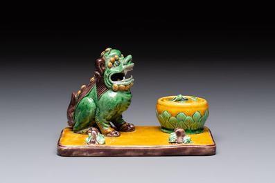 A pair of Chinese sancai-glazed Buddhist lions and an inkwell, 19th C.