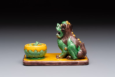 A pair of Chinese sancai-glazed Buddhist lions and an inkwell, 19th C.