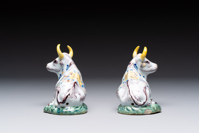 A pair of polychrome Dutch Delft reclining cows, 18th C.